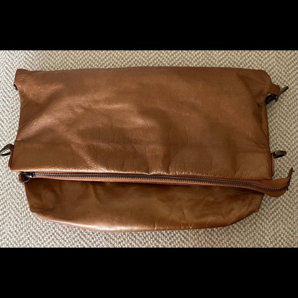 Latico crossbody with adjustable shoulder strap.